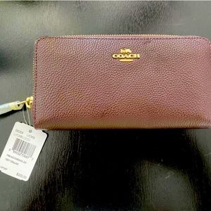 Coach authentic eggplant purple zip around wallet with gold detail/zipper